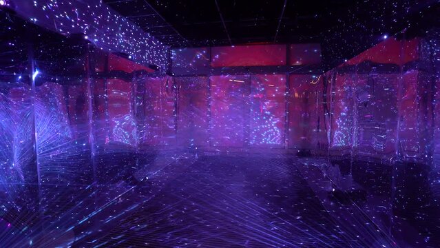 colorful display of light projections in a dark room, creating a vibrant and immersive visual experience.