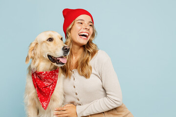 Young cheerful owner woman wear casual clothes red hat bandana hug cuddle embrace her best friend...