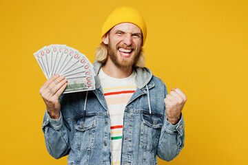 Young blond man he wears denim shirt hoody beanie hat casual clothes hold in hand fan of cash money...
