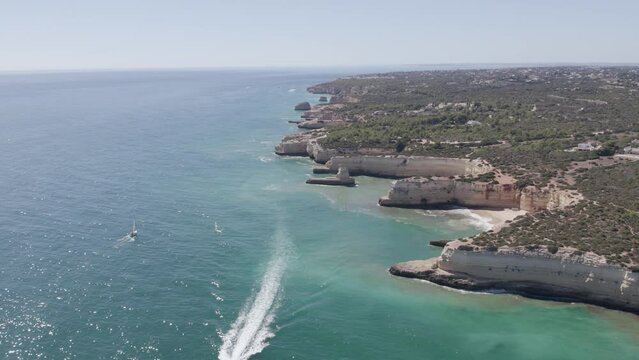 Aerial seascape in Albandeira, popular beach destination of Algarve rocky cliff coast. South Portugal.