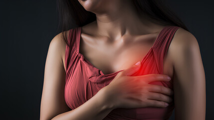 Female who chest pain and her hand touching it