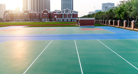 School sport field with basketball court and track