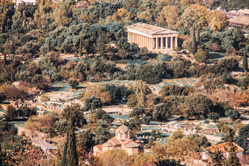 Naklejka premium Temple of Hephaestus (Hephaisteion). Aerial birds eye view photo of iconic temple on ancient Agora. Well-preserved Doric peripteral temple and byzantine Church. Toning. Athens, Attica, Greece