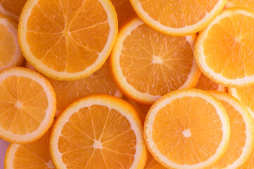 oranges cut into slices and laid out on the table as a food background 10