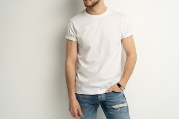 Shirt design and people concept - close up of young man in blank white t-shirt front view isolated