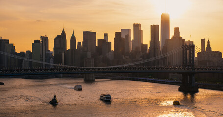 New York City Skyline Aerial Shot from a Helicopter at Sunset. Famous Skyscraper Buildings with...