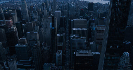 Dark Aerial Evening Photo of New York City with Straight Busy Streets with Cars and Yellow Taxi...