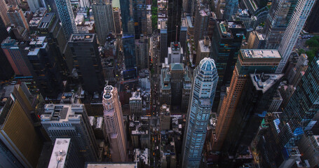 Dark Aerial Evening Shot of New York City with Straight Busy Streets with Cars and Yellow Taxi...