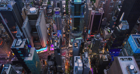 High Angle Aerial Helicopter Shot Over Midtown Manhattan Skyscrapers Cityscape with Lights from...