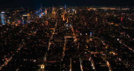Aerial Night View of New York City Avenues in Manhattan, Business and Residential Building Roofs,...