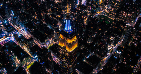New York City Business Center From Above. Aerial Photo of a Famous Art Deco Skyscraper at Night....