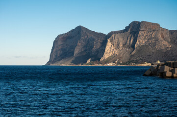 Fototapeta na wymiar Landscape view over the blue sea and the Capo Gallo at Isola delle Femmine, Italy