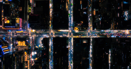 Top Down Aerial View of New York City Streets at Night with Visible Grid System, Business and...