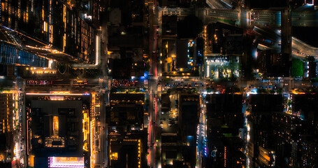 Cinematic Helicopter Night Shot Moving Diagonally Over New York City Avenue Grid System. Top Down...