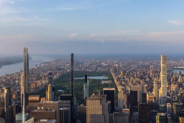 Keuken foto achterwand Central Park New York Cityscape at Sunset. Aerial Photo from a Helicopter. Modern Skyscraper Buildings Around Central Park in Manhattan Island. Focus on Nature, Trees and Lakes in the Park in the City