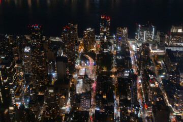 Top Down Aerial View of New York City Streets Lit with Neon Lights from Billboards. Busy Metropolis...