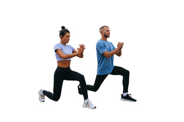 Fototapeta na wymiar Young tanned female trainer training outside with bearded man in sportswear against transparent background makes lunges. Morning workout at resort. Healthy people, sport, togetherness.