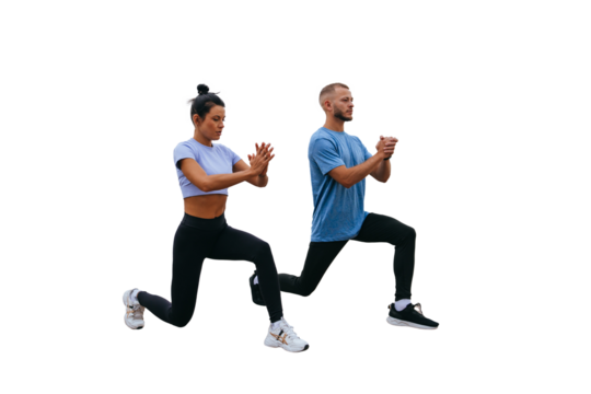 Young tanned female trainer training outside with bearded man in sportswear against transparent background makes lunges. Morning workout  at resort. Healthy people, sport, togetherness.