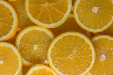 oranges cut into slices and laid out on the table as a food background 1