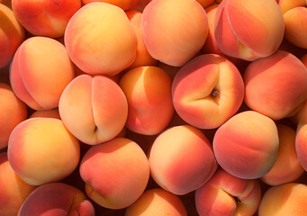 Heap of fresh ripe peaches, top view