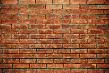Close-up of a red brick wall with a detailed rustic texture, showcasing variations in color and pattern, perfect for backgrounds or design elements