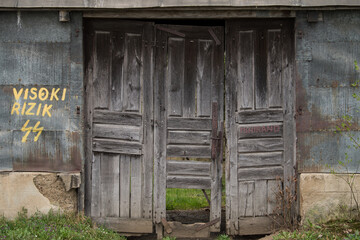 Sunja , Croatia, 05,04,2021: Old wooden rustic door on rural home wall.