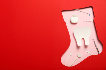 Teeth with Christmas accessories around, flat lay.