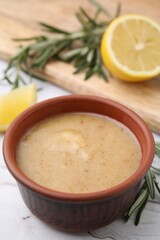 Delicious turkey gravy in bowl on table, closeup