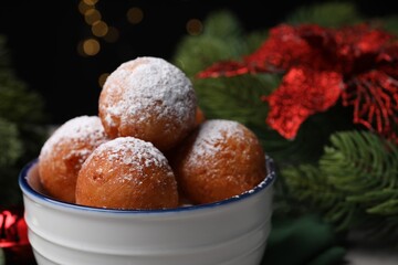 Obraz na płótnie Canvas Delicious sweet buns in bowl against blurred background, closeup