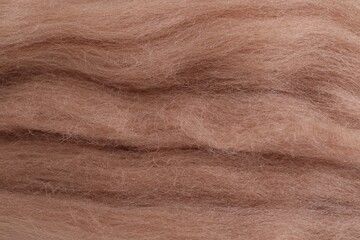 Soft felting wool as background, closeup view