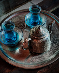 Arabic teapot with two blue glasses. Tea shop. tea time
