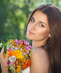 Naklejka premium Beautiful young girl in summer park