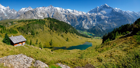 Panoramic view of an alpine landscape of mountains, valley and lakes - AI Generated.