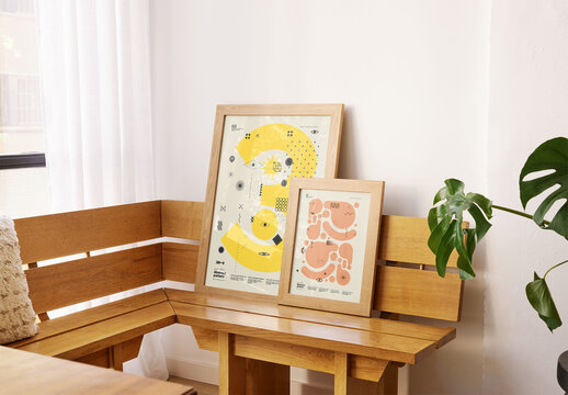 Mockup of two wood picture frames with customizable designs