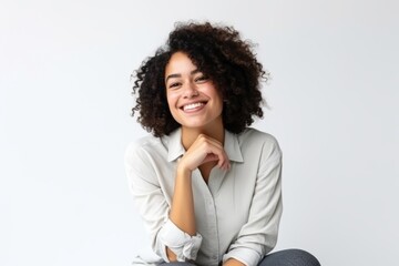 Portrait of a happy young african american businesswoman smiling over white background