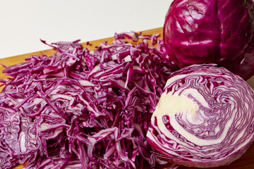 Fototapeta premium Chopped red cabbage on a wooden chopper.