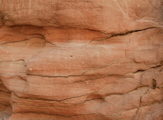 texture of orange stone rock in a colored canyon close up