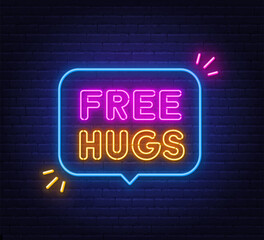 Free Hugs neon sign in the speech bubble on brick wall background.