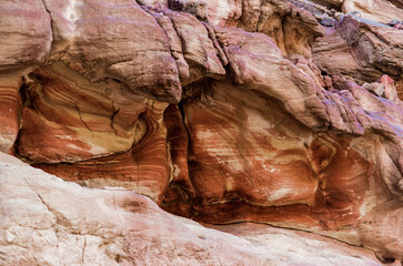 texture of orange stone rock in a colored canyon close up
