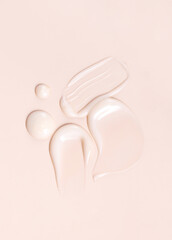 cosmetic smear texture on pastel beige background
