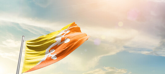 Bhutan national flag cloth fabric waving on the sky - Image