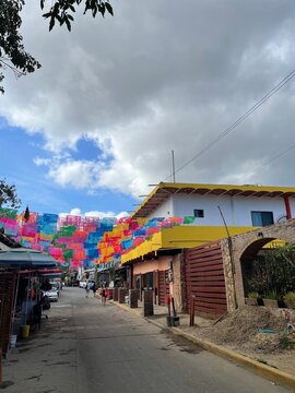 Colorful flags in Mexico against a blue sky