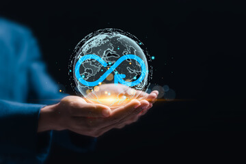 Business planning and strategy concept. Businessman hold virtual global infinity symbol for...