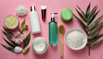Fototapeta na wymiar Embark on a visual journey as we explore an artfully arranged flat lay composition featuring an array of personal care products. Set against a soft and soothing pink background