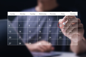 Time management concept. Man use laptop to manage time for effective work. Calendar on the virtual screen interface. Highlight appointment reminders and meeting agenda on the calendar. - Powered by Adobe