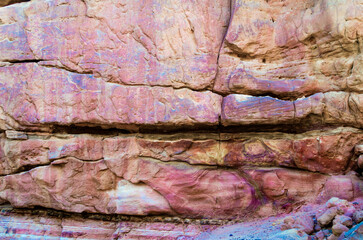 texture of orange stone rock in a colored canyon close up