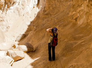 girl photographer takes pictures of the mountains in the canyon in Egypt Dahab South Sinai