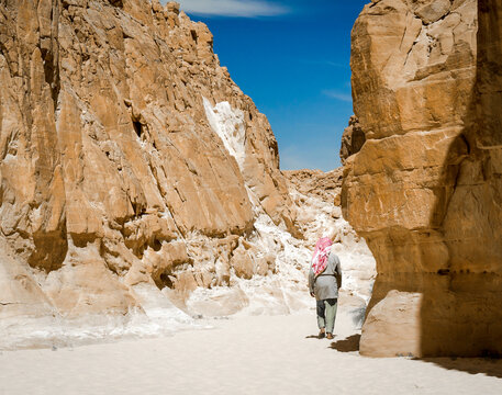 Bedouin walks among the rocks in a desert canyon in Egypt Dahab South Sinai