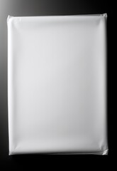 blank white plastic packaging on a dark background