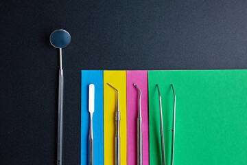 Dental instruments on a colorful background